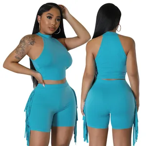 Two-piece solid color leisure set featuring a sleeveless halter top and fringed shorts