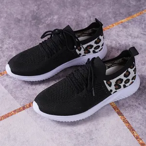 Stylish women's leopard print mesh sneakers with breathable knit and flat white sole.