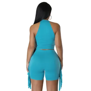 Rear view of a stylish teal sleeveless halter top and matching fringe shorts two-piece set