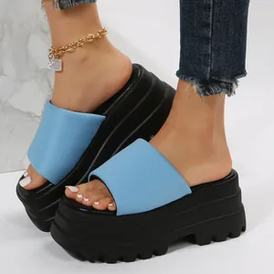 Stylish light blue leather platform wedge sandals featuring a square toe and chunky black sole