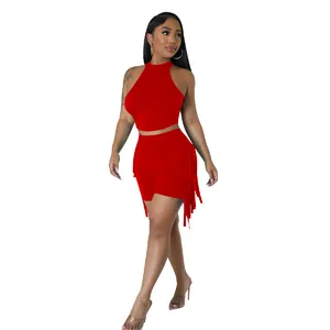 Detailed view of women's red two-piece set with sleeveless top and fringe shorts