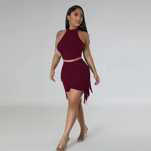 Detail view of wine red two-piece sleeveless set with stylish side fringe shorts.