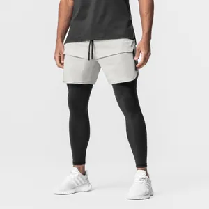 Professional shot of men's light grey athletic running shorts with zipper pockets