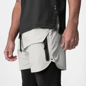 Close-up detail view of men's athletic shorts featuring zipper pocket and built-in liner