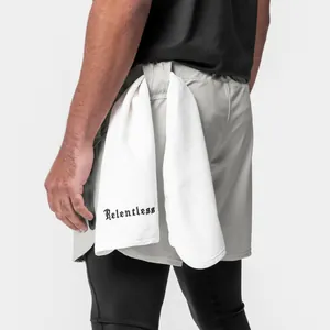 Close-up detail of men's sports shorts showing functional towel loop and zipper pocket