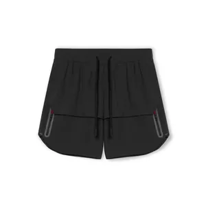 Macro detail of black athletic shorts with red zipper pockets and drawstring waist