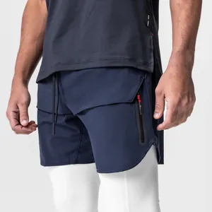 Close-up detail of men's navy athletic shorts with zipper pocket and white inner layer.