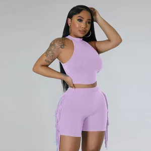 Detailed side view of lavender sleeveless crop top and fringed shorts matching set