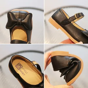 Elegant black Mary Jane shoes for girls featuring a bow detail and flexible soft sole