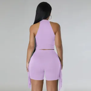 Back view of stylish lavender sleeveless halter top and fringe shorts two-piece casual set