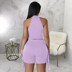 Detail showing the stylish back view of purple sleeveless fringed two-piece casual set