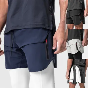 Detail view of men's double-layer athletic shorts with zipper pockets and towel loop