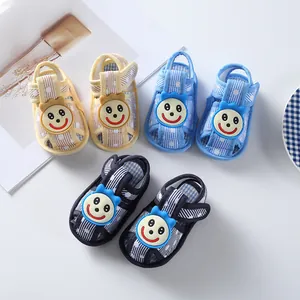 Soft-soled baby walker sandals with a striped pattern and a cute smiling cartoon face detail