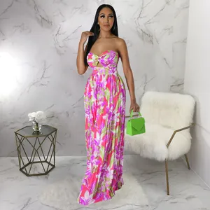 Combinaison pantalon d'été dos nu avec imprimé floral rose et vert très dynamique
