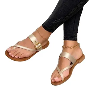 Elegant champagne gold women's flat sandals with toe loop and stylish buckle strap