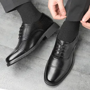 Elegant black men's business leather shoes with breathable perforated cap-toe design