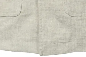 Close-up of high-quality beige linen fabric texture and stitching on men's utility jacket.