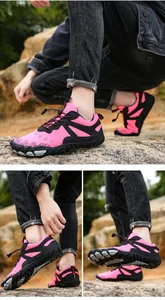 Detailed views of pink and black breathable outdoor hiking and cycling shoes on rocks