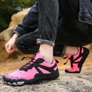 Breathable pink outdoor hiking shoes for men and women with non-slip soft soles.