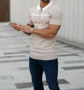 Close-up detail of slim fit knitted polo shirt with white collar and chest stripe
