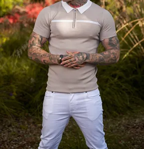Close-up of men's slim-fit knit polo shirt with contrast collar and zip neck