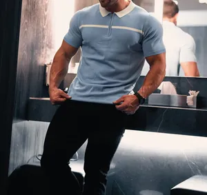 Slim fit light blue color-block knit polo shirt with zipper and white collar detailing.