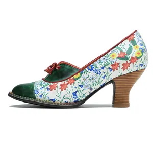 Detailed side view of vintage floral pump featuring green leather toe and wooden cone heel