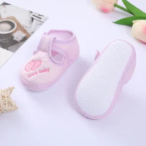 Pink striped baby walking shoes featuring soft non-slip soles and heart embroidery