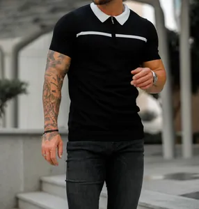 Slim fit men's black knit polo shirt with white collar and chest stripe detail