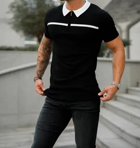 Men's slim-fit black polo shirt with white contrast collar and horizontal chest stripe