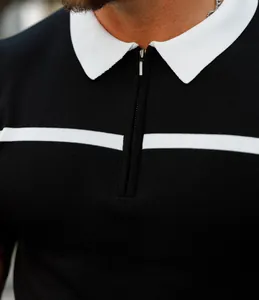 Close-up of a men's slim fit polo shirt with a white collar and zipper detail.