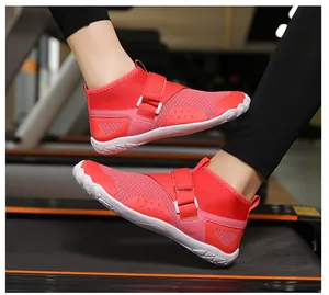 Close-up of red high-top wading shoes on a treadmill highlighting the mesh design.