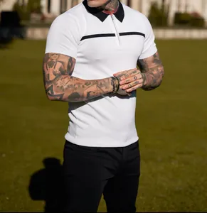 Close-up of slim fit white polo shirt with black collar and chest stripe detail
