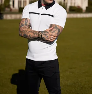 Close-up of slim fit white polo shirt with contrast black collar and zipper detail