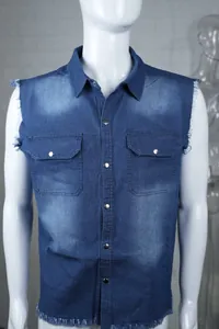 Detail of men's blue denim sleeveless vest with lapel collar and frayed edges