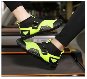 Close-up of high-top neon green barefoot water shoes on a treadmill for fitness training