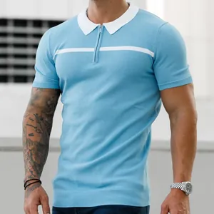 Close-up of men's slim fit light blue polo shirt with white collar and zipper detail.