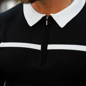 Macro detail of men's slim-fit knitted polo shirt featuring a zipper and contrast collar