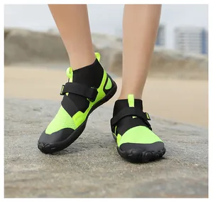 Lime green and black high-top water shoes for swimming and beach activities on rocks.