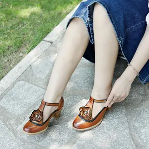 Handmade vintage rubbed leather Mary Jane high heels featuring 3D flower decoration