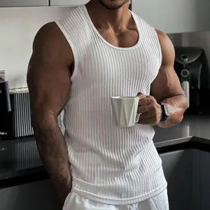 Detail shot of a white ribbed slim fit knit vest for men on a muscular model