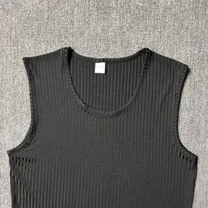 Macro view of black ribbed texture on men's sleeveless knitted slim fit tank top