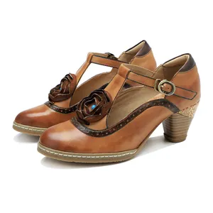Detailed side view of vintage hand-rubbed leather Mary Jane heels with floral accents.