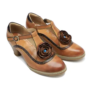 Detailed view of vintage hand-rubbed leather Mary Jane high heels with 3D leather rose