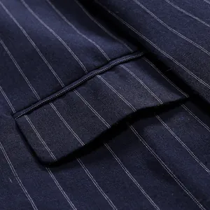 Detailed close-up view of navy blue pinstripe men's suit jacket pocket and fabric texture