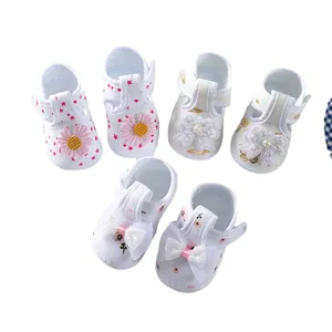 Cute baby soft-sole cloth shoes for 0-1 year old infants with floral and bow designs.