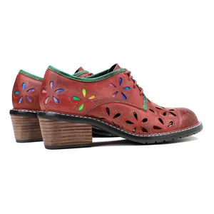 Vintage red leather oxfords with colorful floral cut-outs and a stacked block heel.