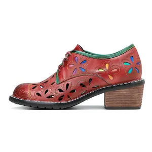 Vintage genuine leather shoes featuring floral hollow cutouts and colorful accents.