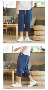 Side and front views of relaxed blue linen cropped pants featuring traditional Chinese style