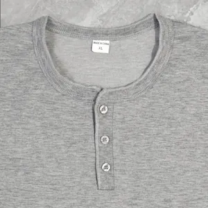 Close-up of grey marled men's Henley tank top showing neckline and 3-button placket detail